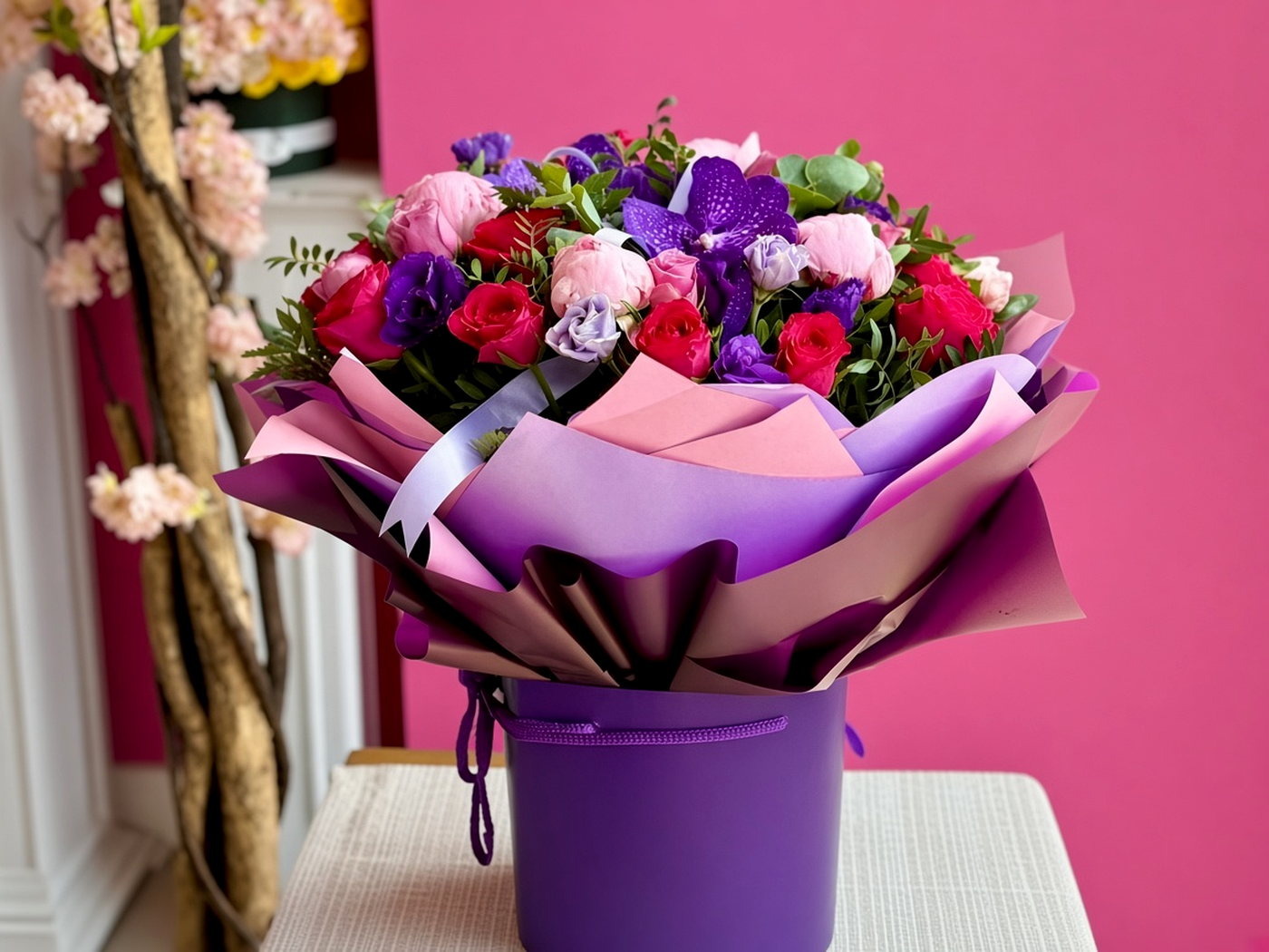 Wrapped bouquet delivered to a pale doorstep